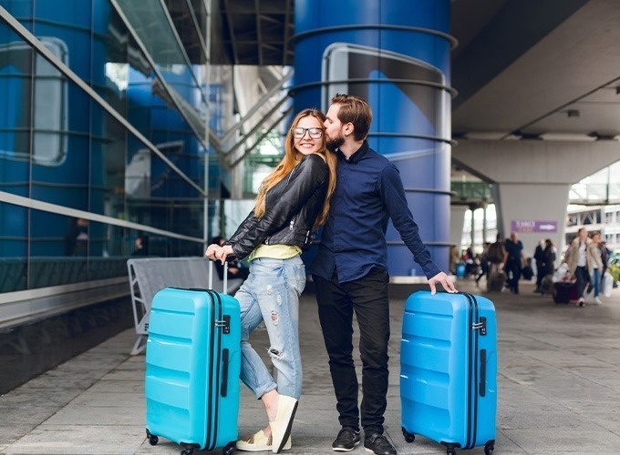 a woman is sitting on the floor holding a small airplane