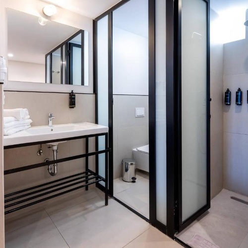 a bathroom with a sink and a walk in shower
