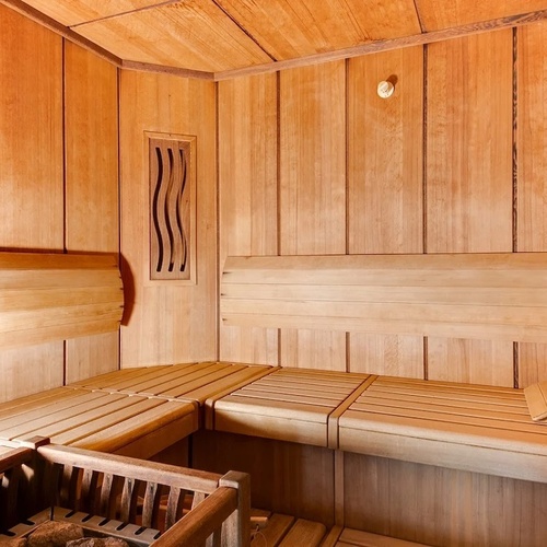 the inside of a wooden sauna with a window
