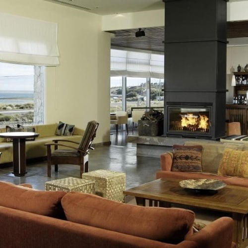 a living room filled with furniture and a fireplace