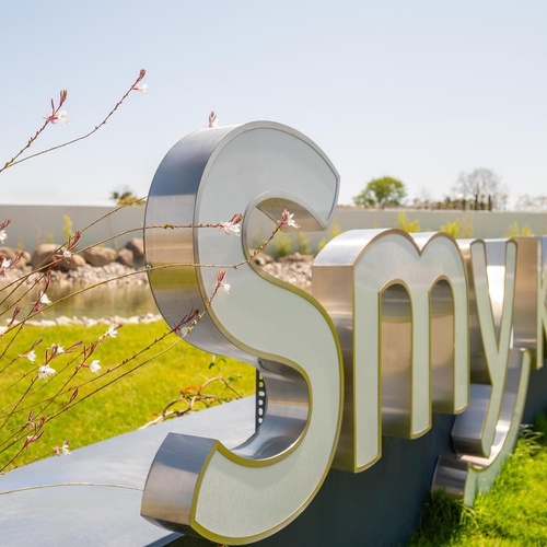 a large metal sign that says smv on it
