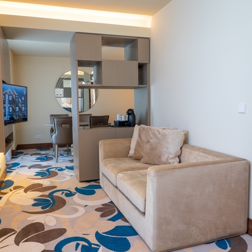 a living room with a couch and a television