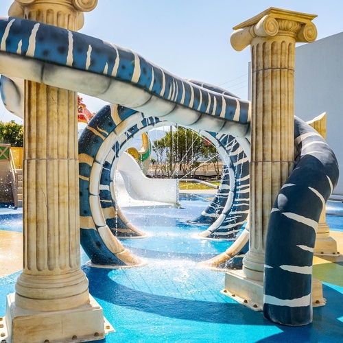 a water park with columns and a water slide