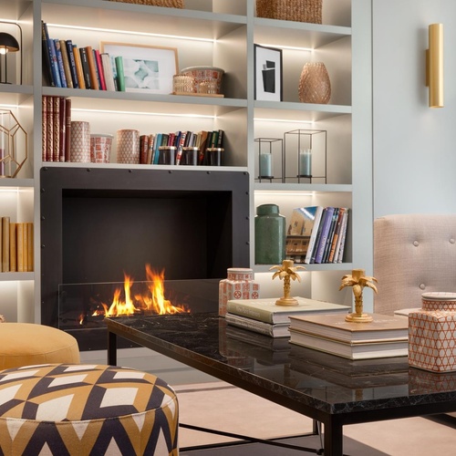 a living room with a fireplace and a couch