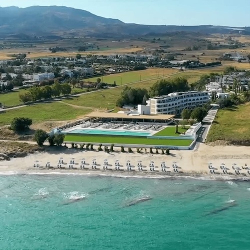 a restaurant with a view of the ocean and the sunset