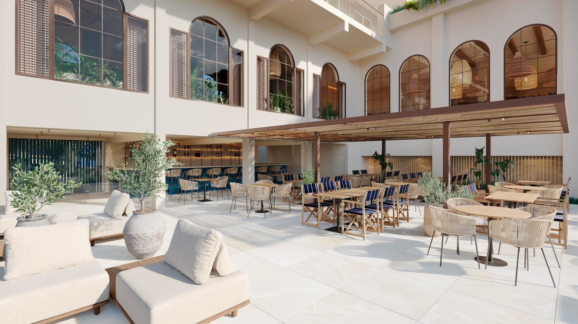 a glass of red liquid with a straw on the beach