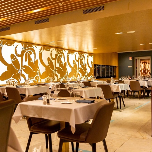 a restaurant with tables and chairs and a sign that says exit