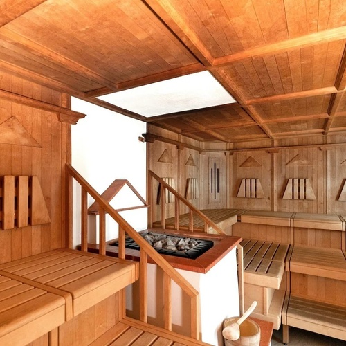 a wooden sauna with stairs leading up to it