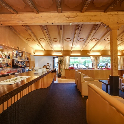 a bar in a restaurant with a sign that says ' coca cola ' on it