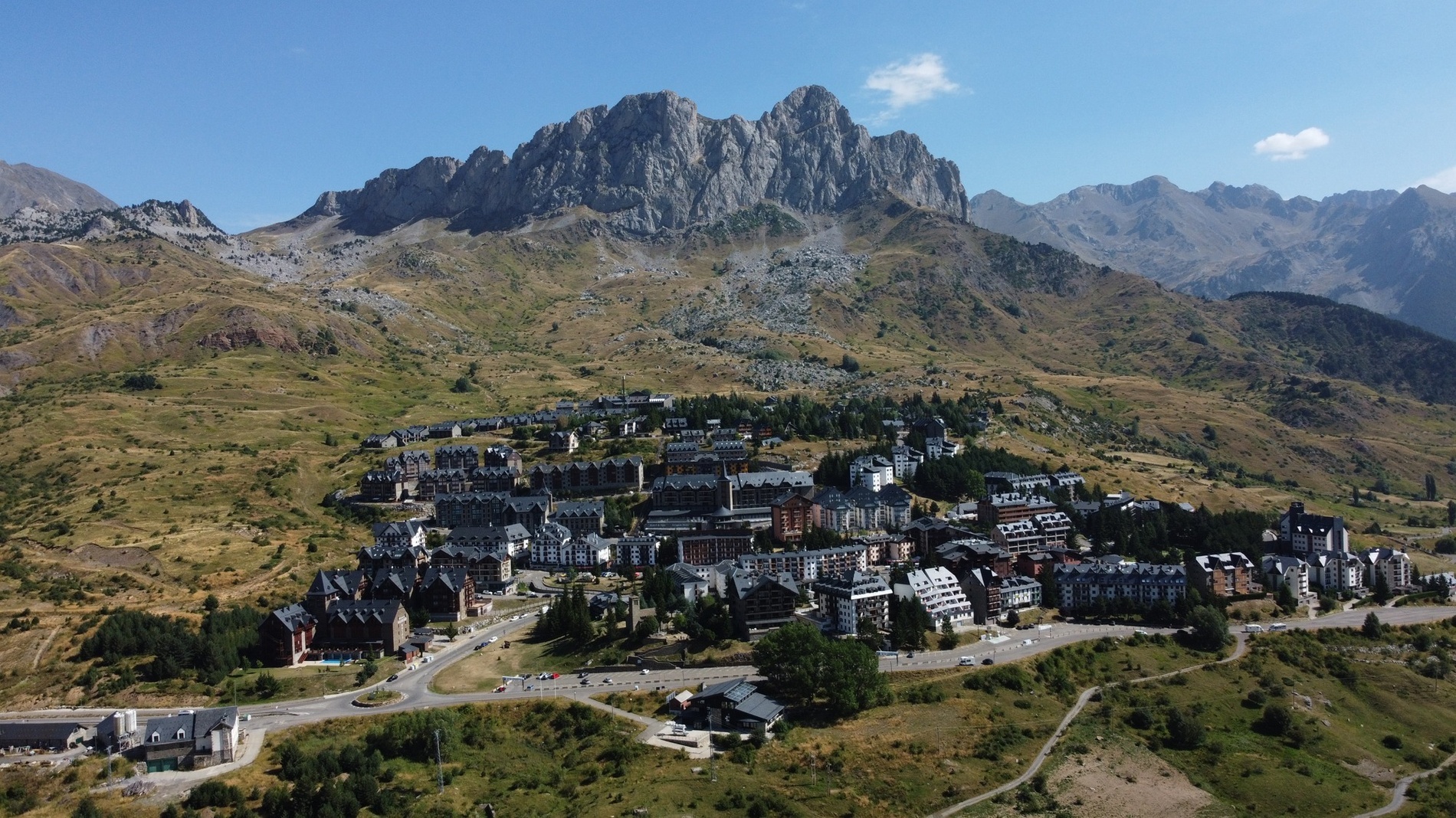an aerial view of a small town in the mountains