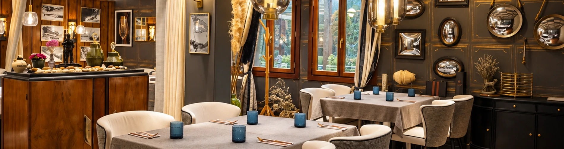 Elegant dining room with tables set for guests at this luxury SNÖ Candanchú.