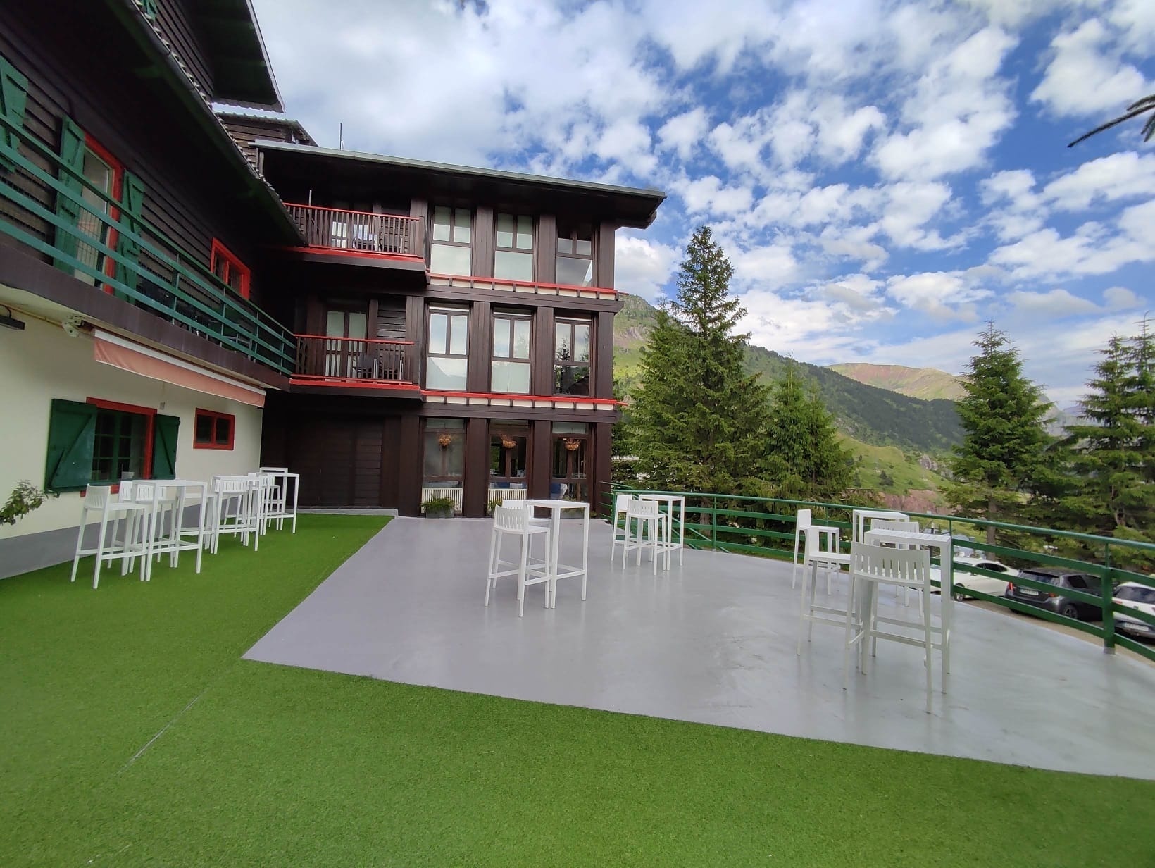 a field of yellow and white flowers with a green background