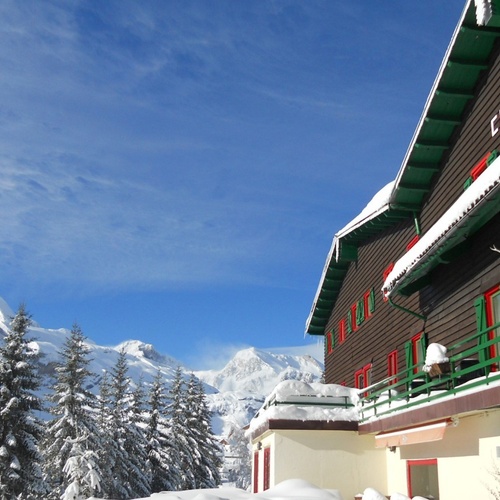 the hotel candanchu is surrounded by snow covered mountains