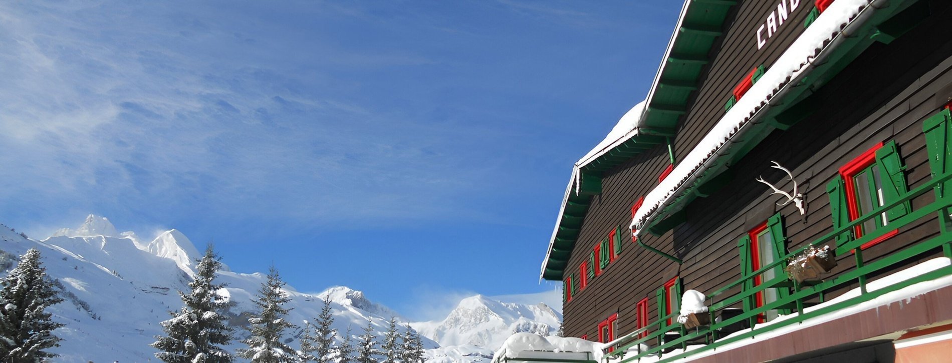 the hotel candanchu is surrounded by snow covered mountains