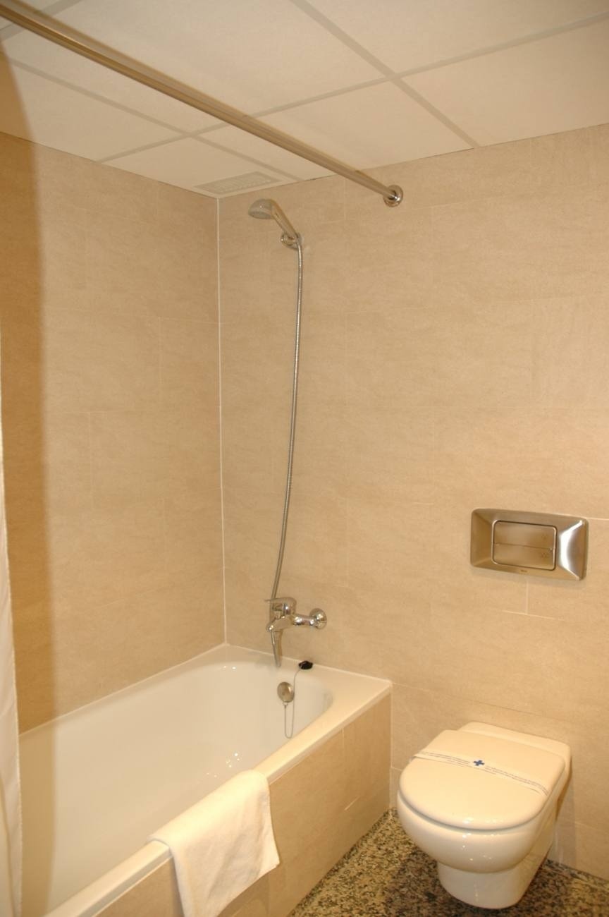 a bathroom with a bathtub toilet and shower