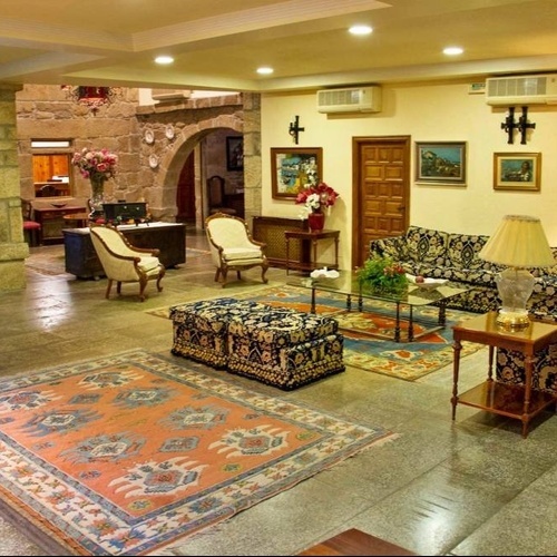 a living room filled with furniture and a rug