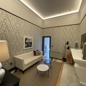 a living room with a couch and two tables