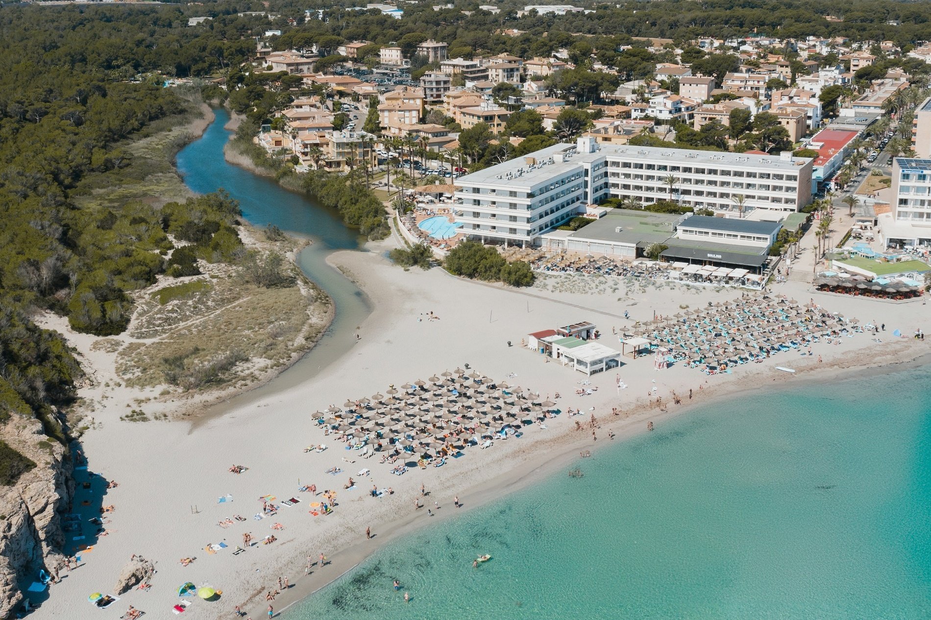 Aerial photo of the hotel with the sea and the Son Baulo torrent 
