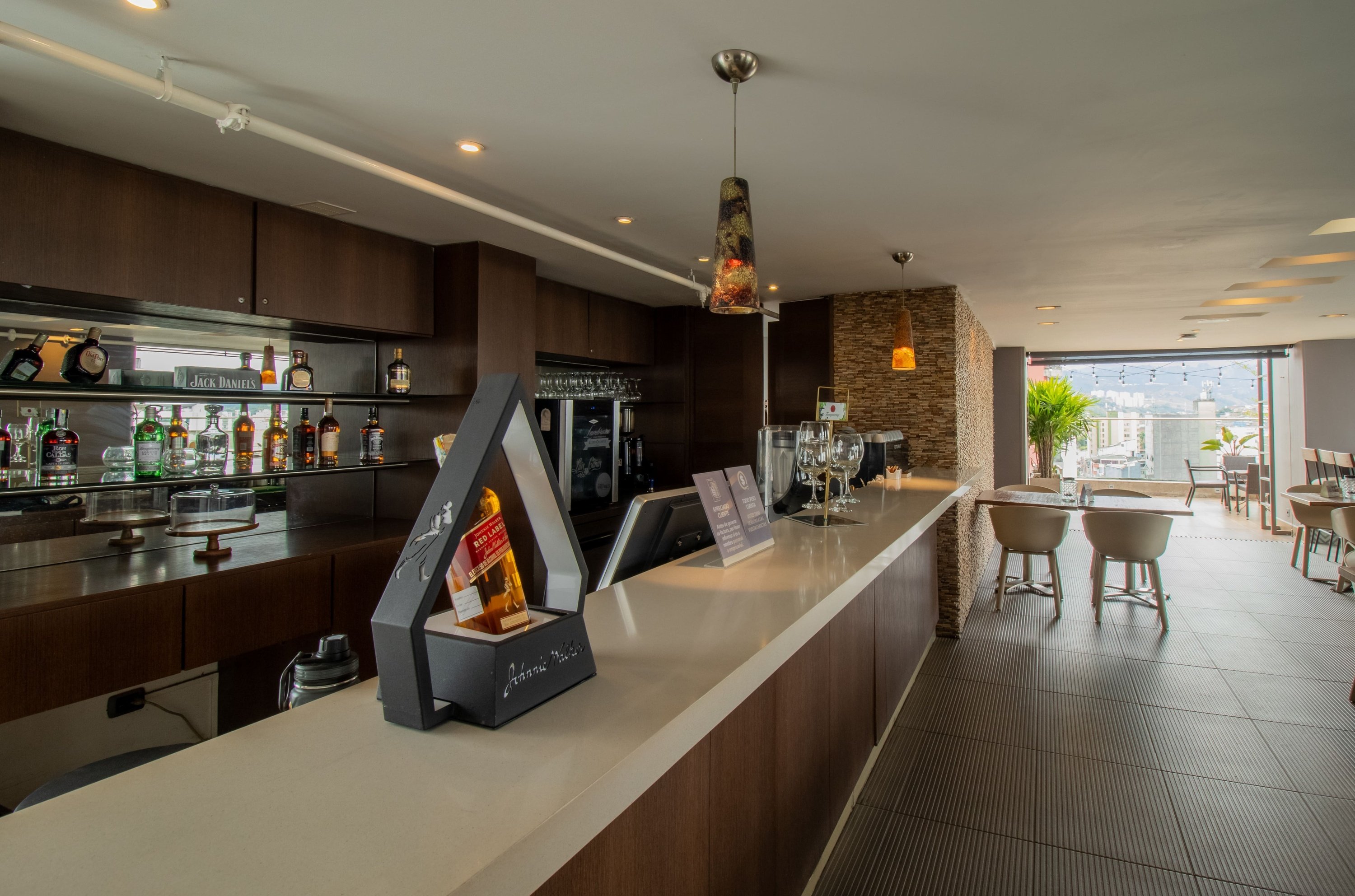 a bar with a bottle of jack daniels on the counter