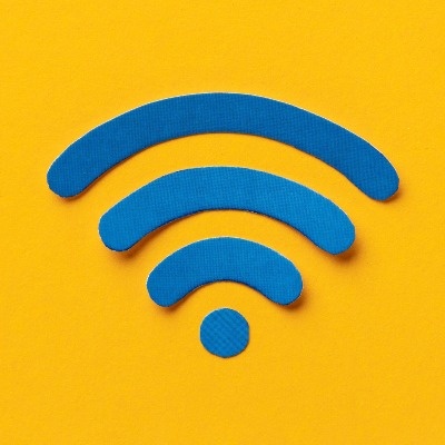 a blue and white wifi symbol on a yellow background