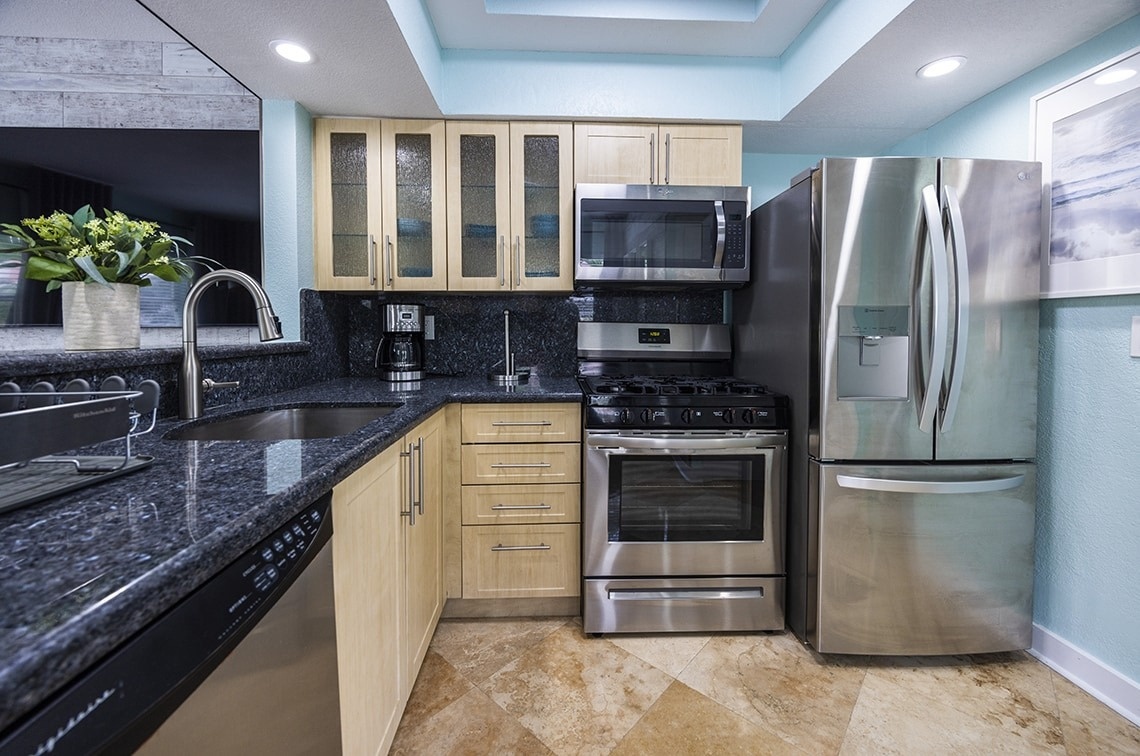 a kitchen with stainless steel appliances including a frigidaire refrigerator