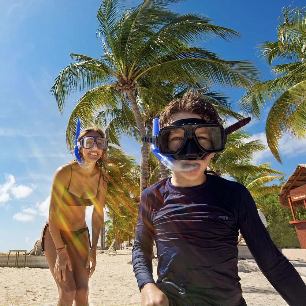 Couple ready for snorkeling in tropical paradise at Sunset Hotels Collection: Corporativa resort.