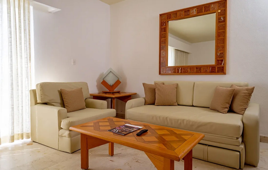 Sofá y sillón en sala de estar, Sunset Fishermen Beach Resort | Página Oficial