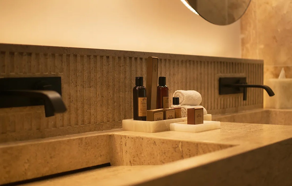 Hacienda Tres Rios luxury bathroom with toiletries and modern fixtures.