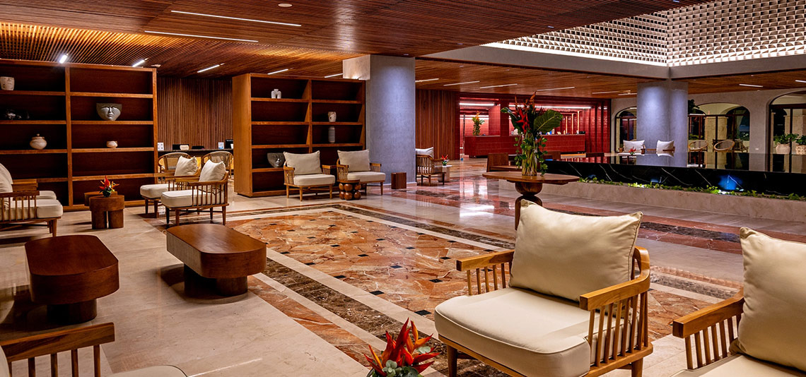 Hacienda Tres Rios lobby: Luxury seating & wood accents. Official Page.