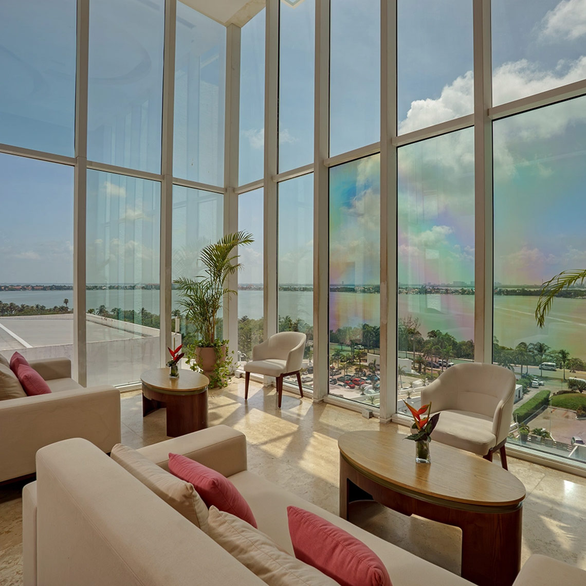 Modern lounge with stunning ocean views at Sunset Royal Beach Resort.