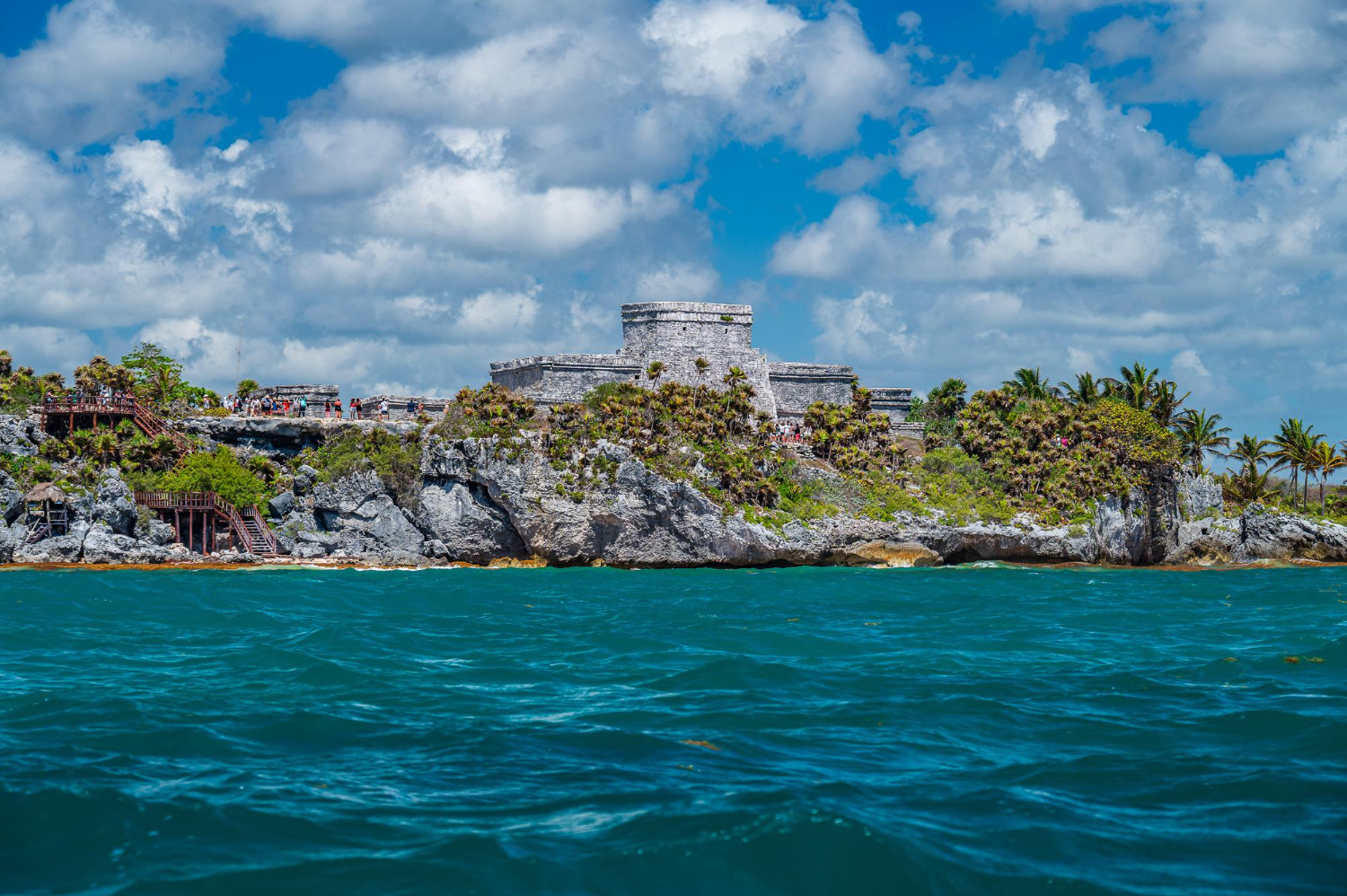 Tulum ruins overlooking turquoise sea, ideal for a tropical Sunset Hotels Collection: Corporativa getaway.