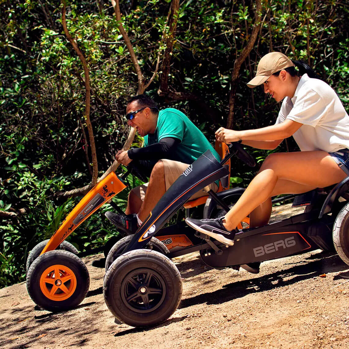 Hacienda Tres Rios | Official Page: Guests race go-karts on a dirt track.