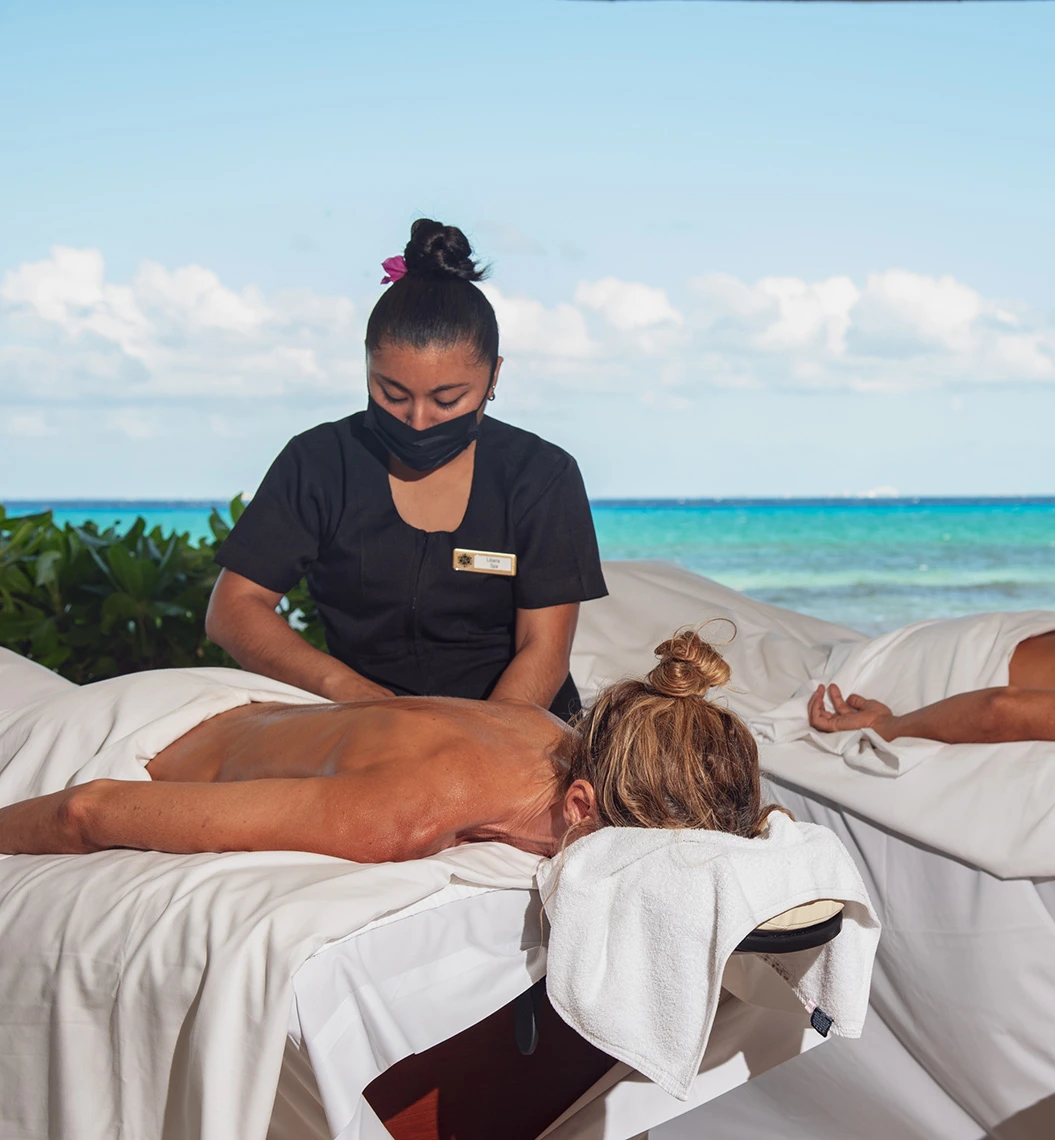 Woman relaxing on massage table at Sunset Hotels Collection: Corporativa