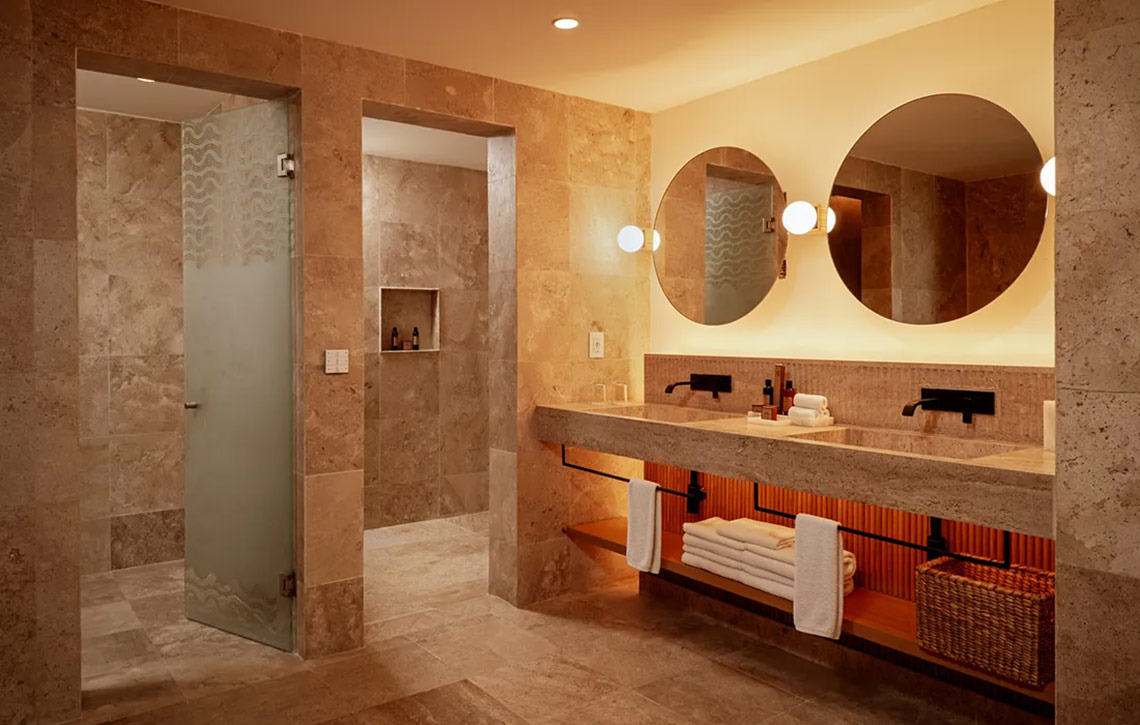 Luxury bathroom with dual sinks & shower at Hacienda Tres Rios.