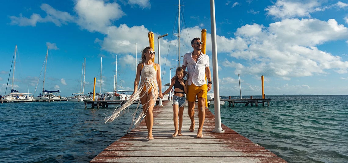Family strolls on a pier at Ocean Spa Hotel | Official Page