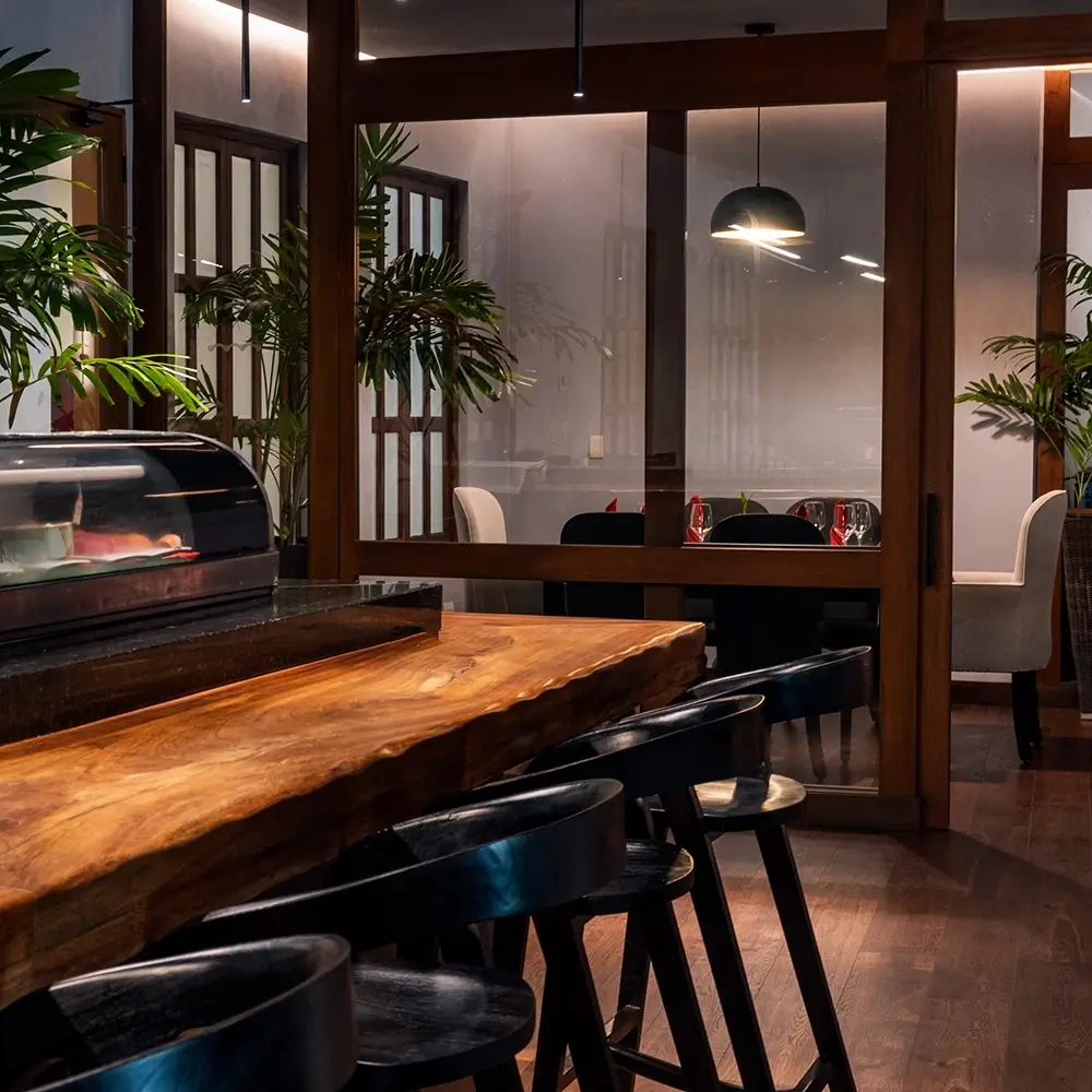 Sleek sushi bar and dining area at a modern hotel Sunset World Resorts: Corporativa.