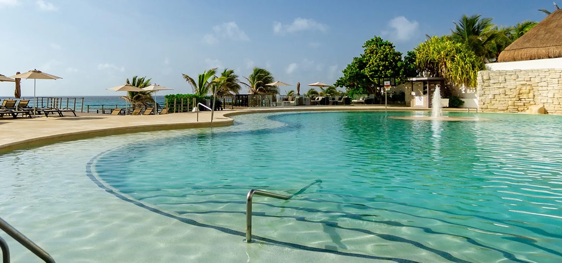 Sunset Royal Beach Resort | Official Page: Crystal blue pool with ocean view