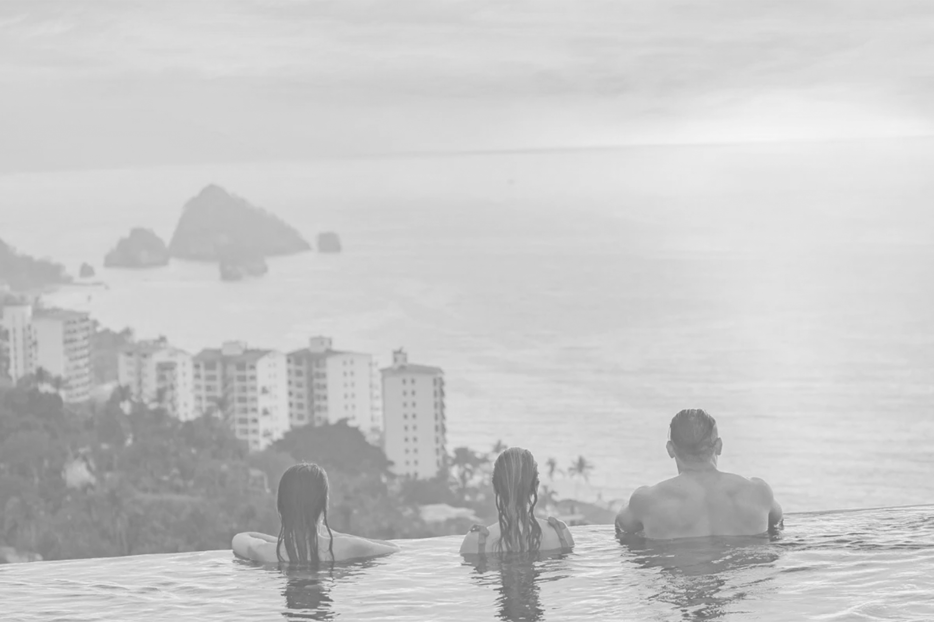 a woman laying on a blanket on the beach with her legs crossed=s1900
