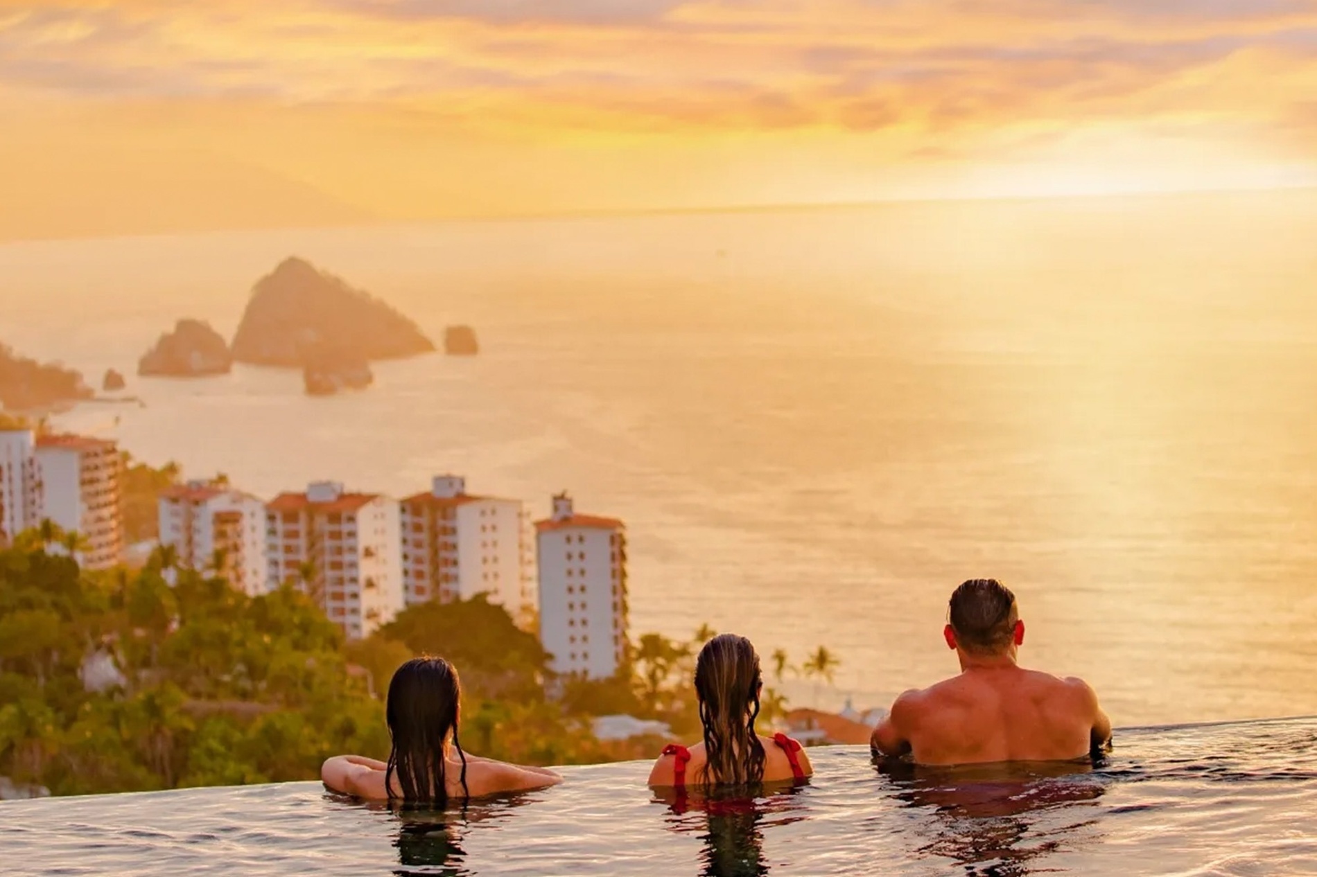 a woman laying on a beach with her legs crossed