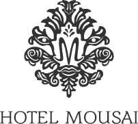 a black and white logo for a hotel with a floral design on a black background .
