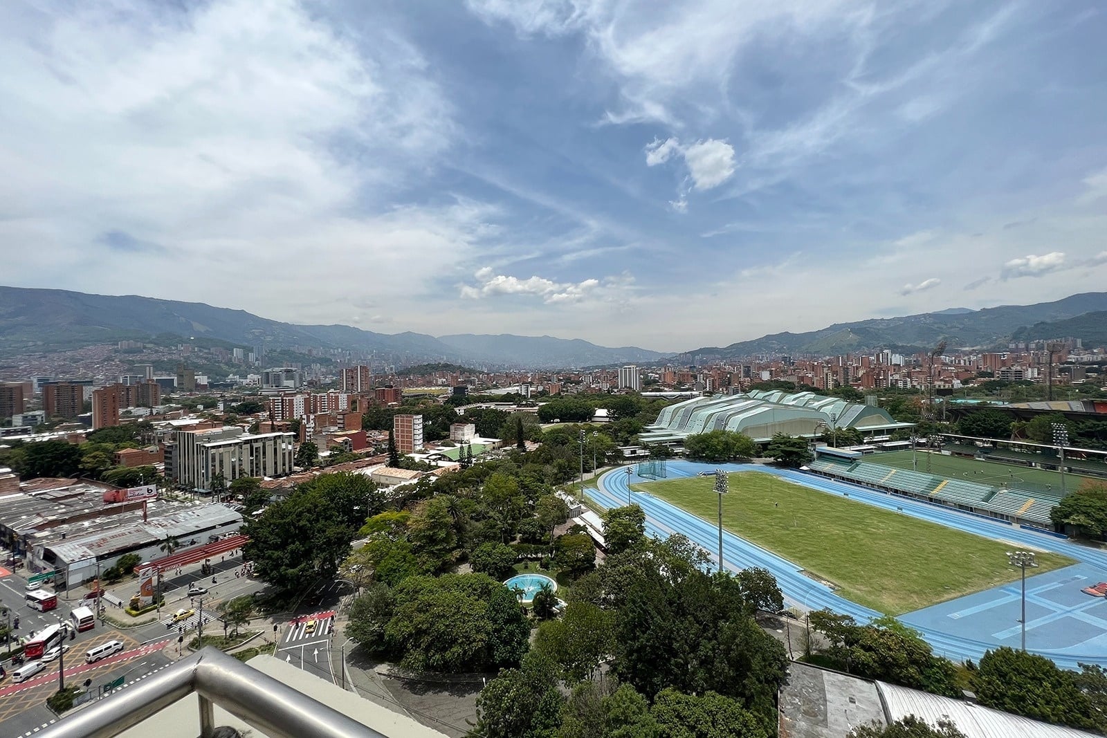 View from Tequendama Hotel Medellín: city, mountains, and sports complex. Rooftop jacuzzi nearby!