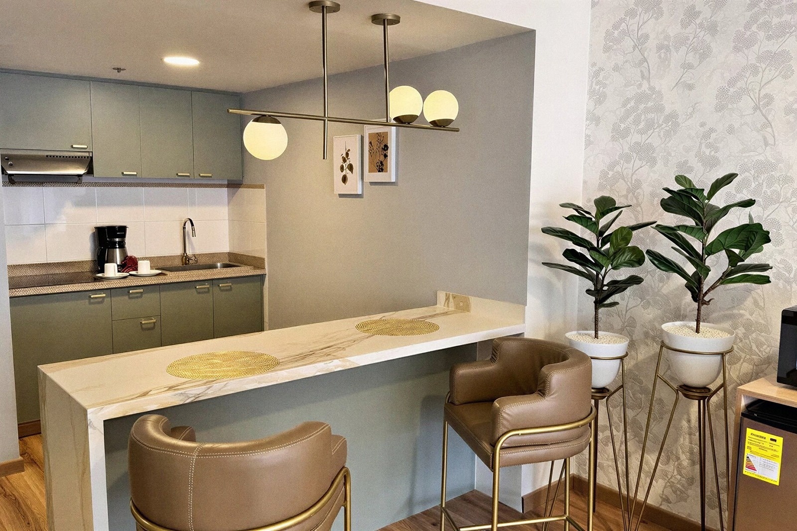 Modern kitchen with bar seating at Tequendama Suites Bogotá, your downtown Bogotá suite.