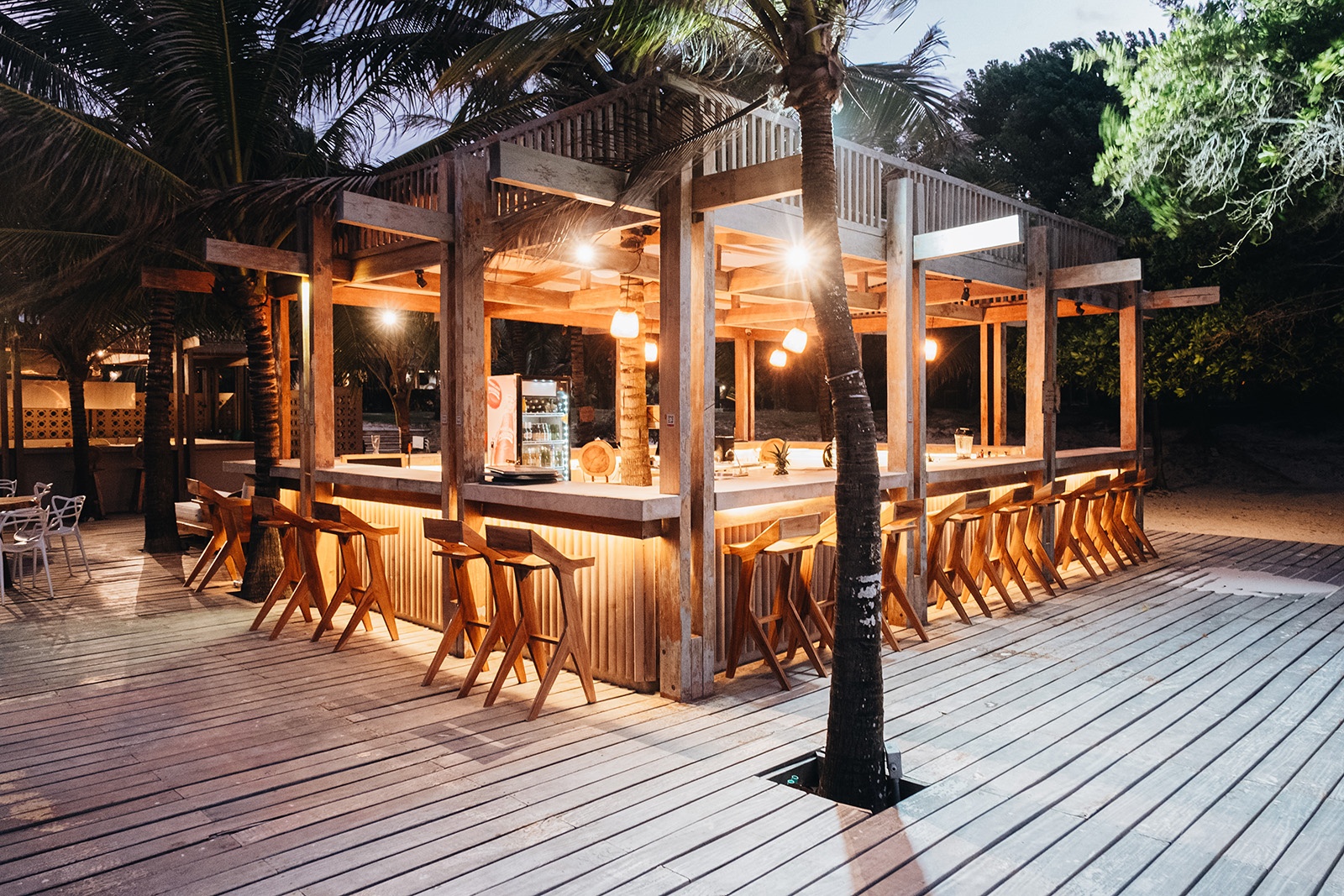 Tropical bar at dusk, perfect for Tequendama: Corporativa events and relaxation.