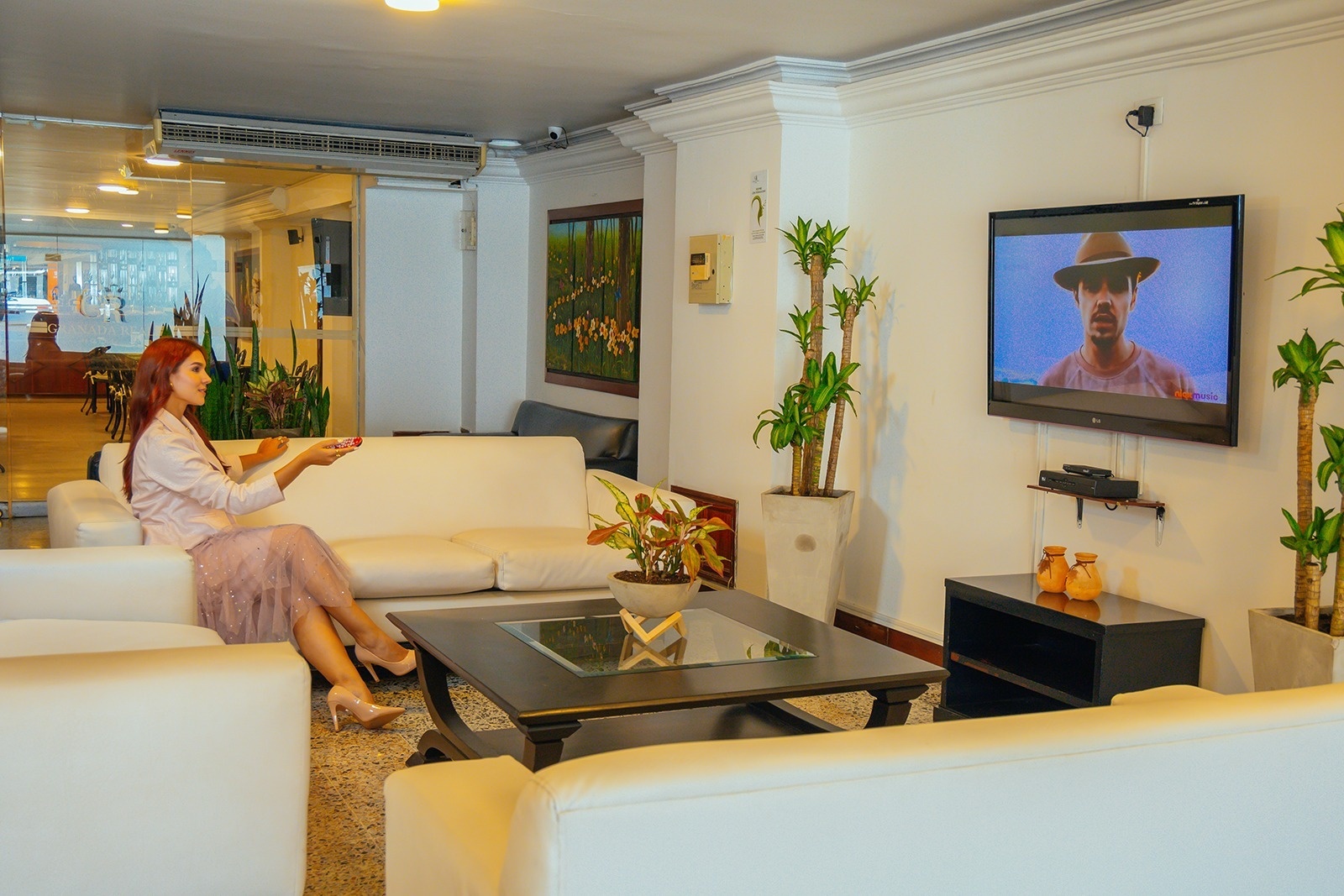 Guest relaxing at Tama Hotel Granada Real, North Cali. Book your stay!