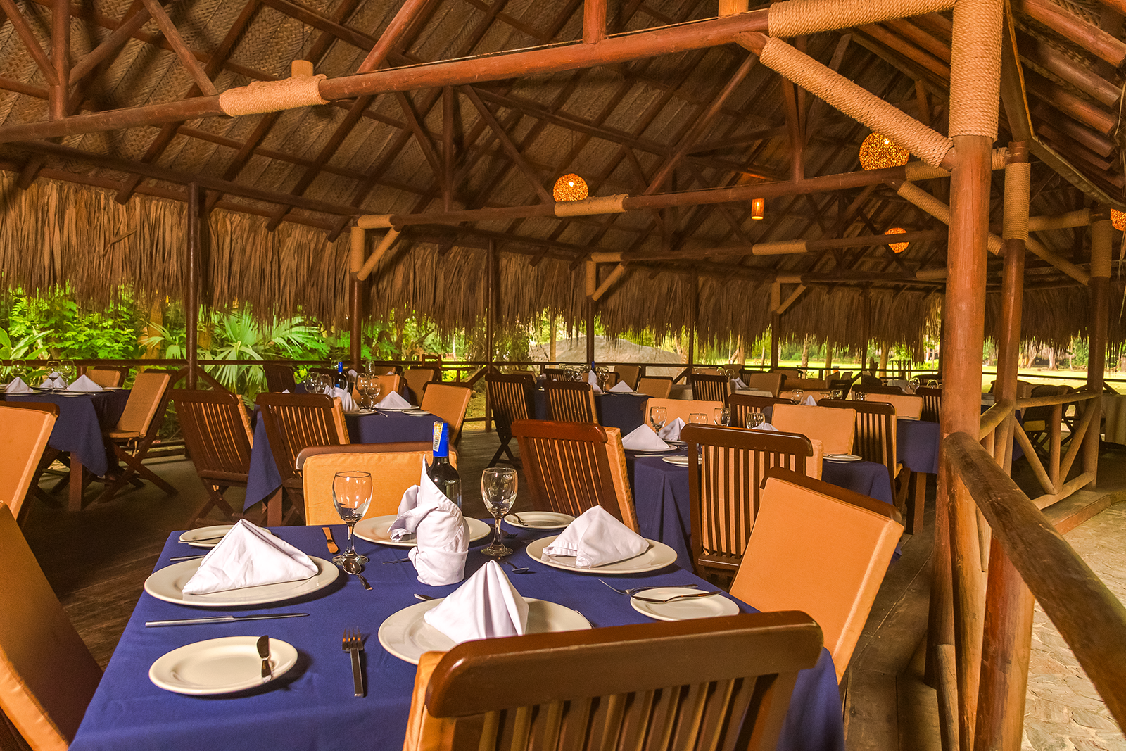 Dining tables set for a meal at Ecohabs Tequendama | Tayrona Park Eco-Hotel.