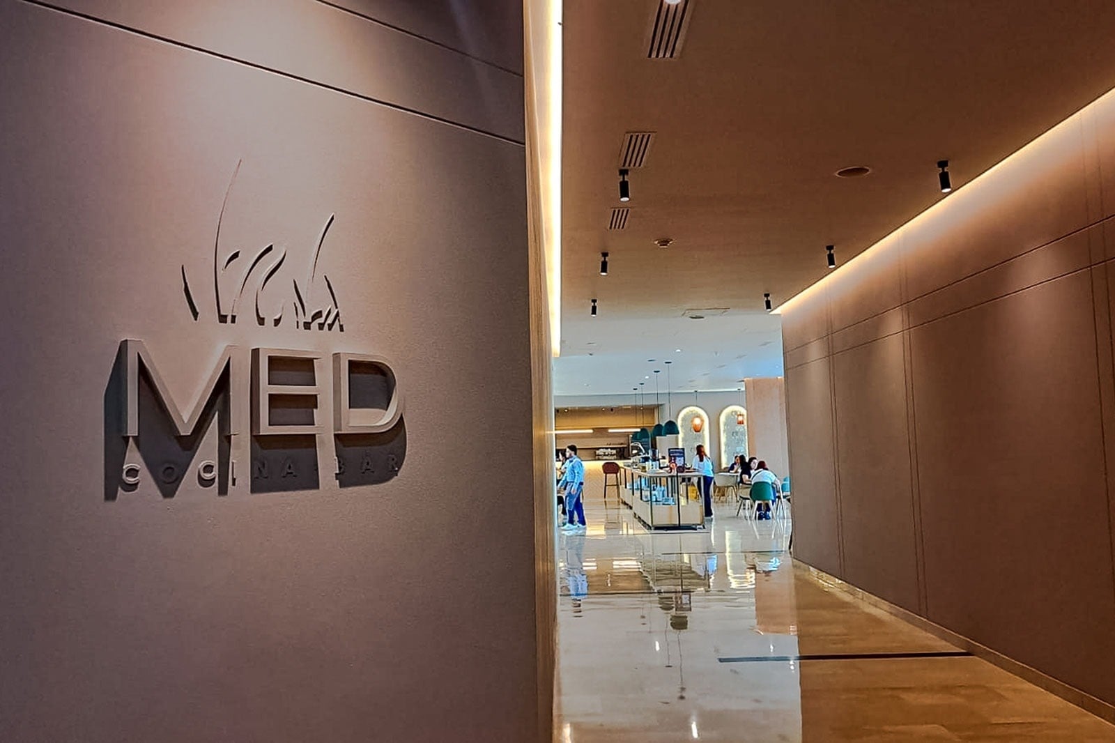 MED Cocina Bar logo and hallway at TQ Tequendama Hotel: Corporativa.