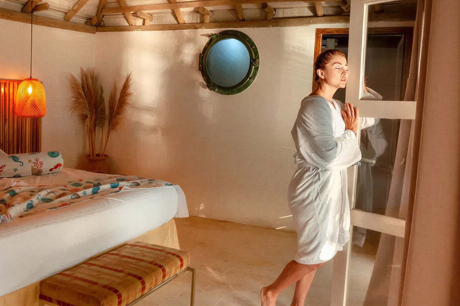 Woman in bathrobe at Hotel Rosario de Mar By Tequendama, Islas del Rosario.