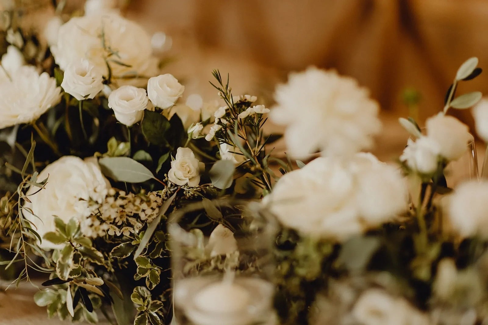 Tequendama Corporate: White roses and green foliage floral arrangement.
