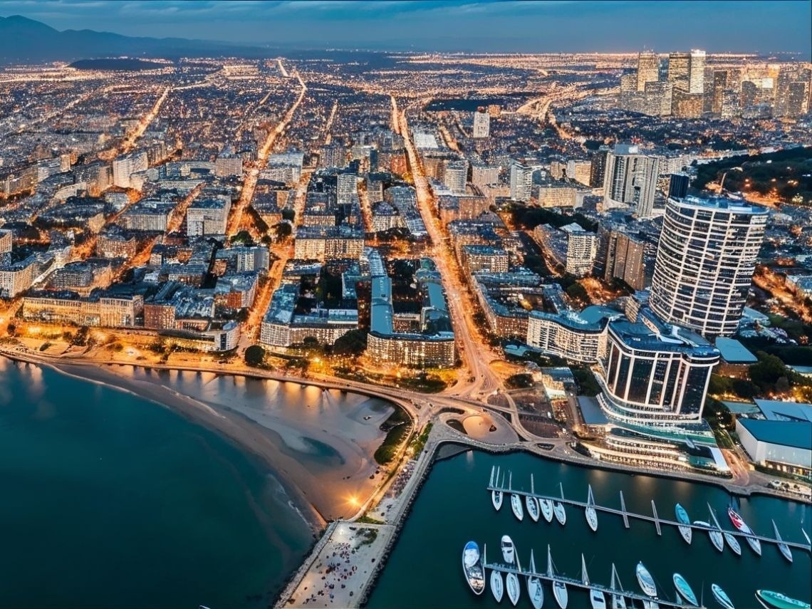 Aerial view of Hotels in Santa Marta | Tequendama, showing city lights & marina