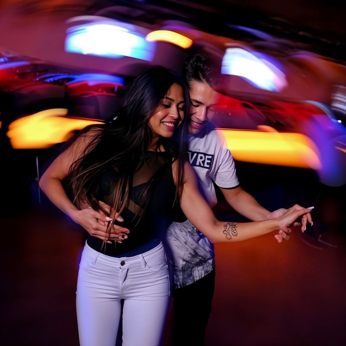 Couple dancing at Tequendama: Corporativa, festive atmosphere with vibrant lights.